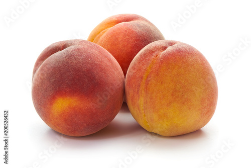 Fresh peaches, close-up, isolated on white background.