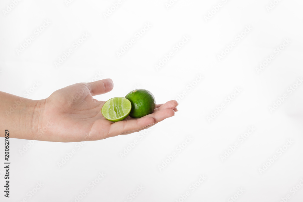 Hand holding lime isolated white background. Hand holding lime isolated white background.