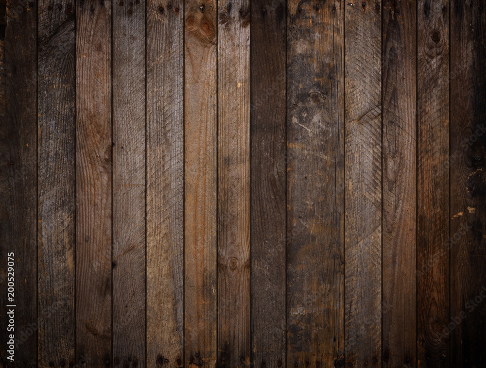Naklejka premium Dark rustic wooden planks background