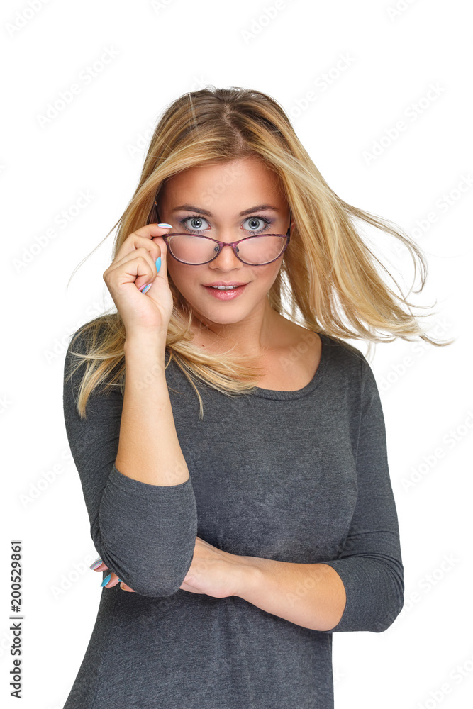 Young cute girl looking out from under her glasses