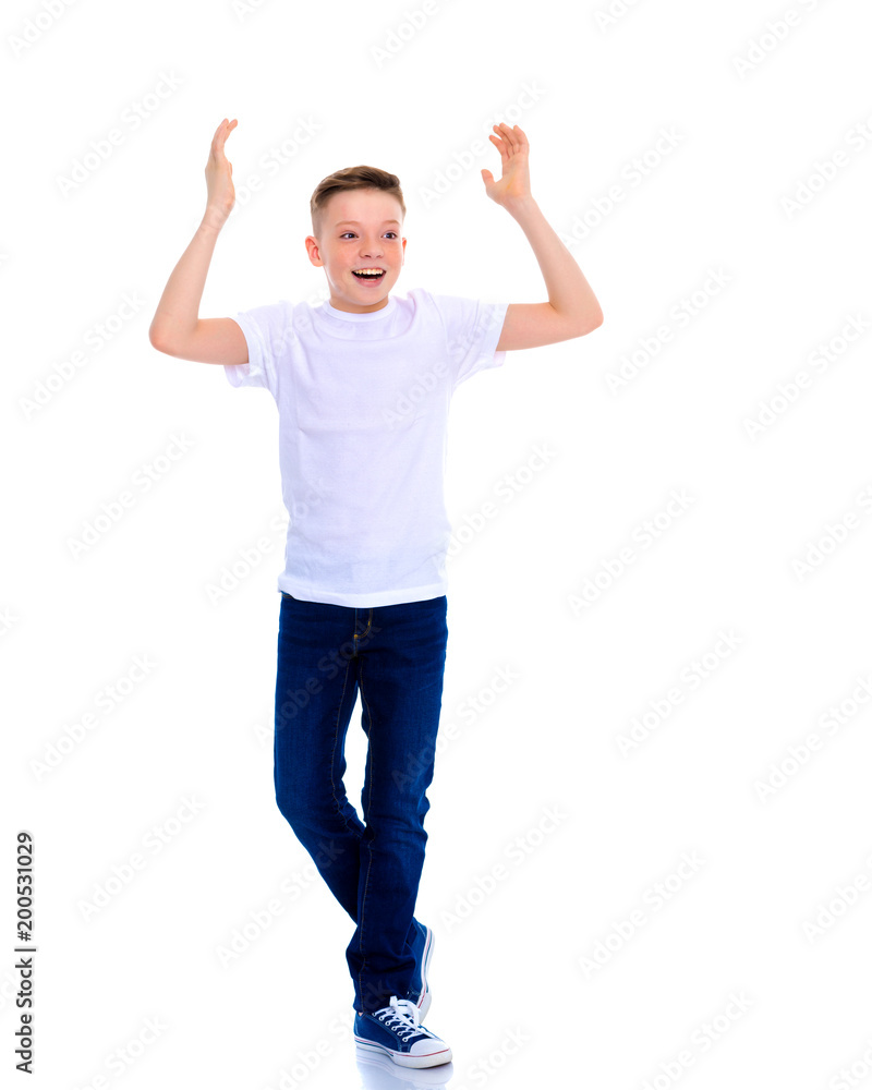 A little boy in a white T-shirt emotionally gestures with his ha A little boy in a white T-shirt emotionally gestures with his ha