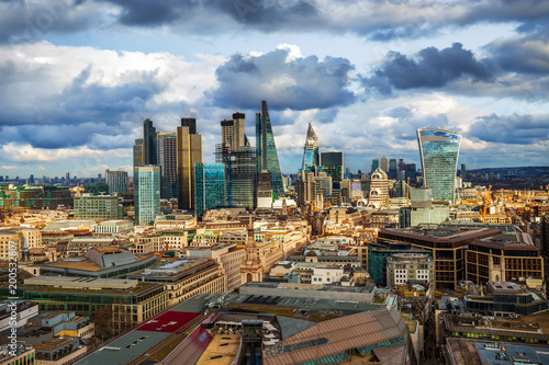 London, England - Panoramic skyline view of Bank and Canary Wharf, London's leading financial districts with famous skyscrapers and other landmarks at golden hour sunset. Beautiful sky and clouds