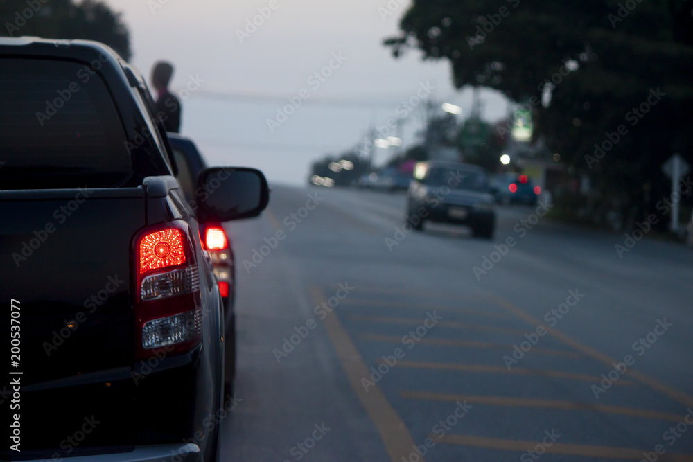 Cars break on the road by traffic jam on evening.