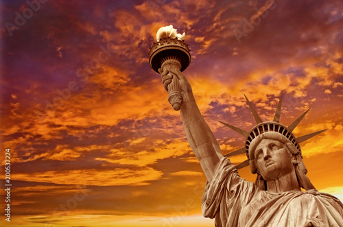 Fotografie, Tablou Statue of Liberty, dramatic sky background. New York City, USA