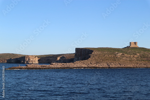 View of the Comino island and Saint Mary tower, Malta