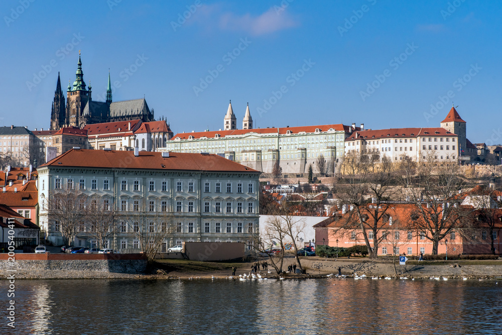 The castle can be seen on the hill overlooking the River Vtlava in Prague, Czechia