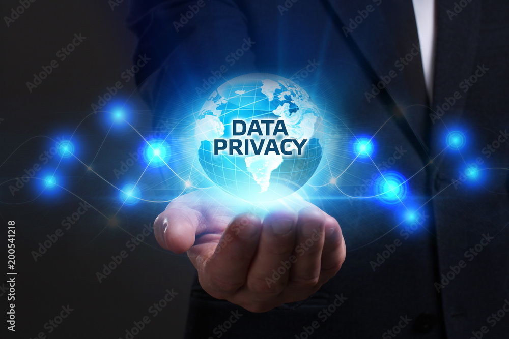 Business, Technology, Internet and network concept. Young businessman working on a virtual screen of the future and sees the inscription: Data privacy Business, Technology, Internet and network concept. Young businessman working on a virtual screen of the future and sees the inscription: Data privacy