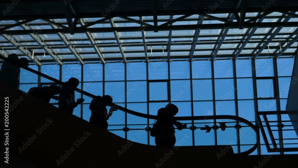 Career success concept: figures of businessman and businesswoman elevated on the steps to modern economic trade centre for occupation presentation and sale forum. Workers going on the job at morning Career success concept: figures of businessman and businesswoman elevated on the steps to modern economic trade centre for occupation presentation and sale forum. Workers going on the job at morning