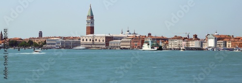 island of venice with ancient palaces and bell towers with long exposure time and the wake of the movement of ships
