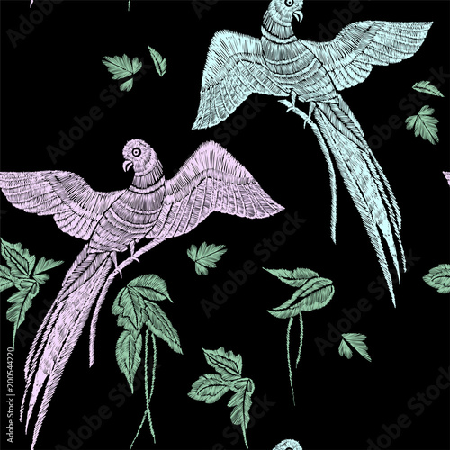 Parrots with tropical leaves seamless background pattern. Vector illustration hand drawn. Embroidery design.