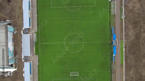 Aerial view of district soccer field with players training on grass