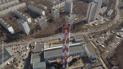 Smoking pipes in industrial zone of the city near residential area