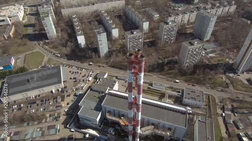 Smoking pipes in industrial zone of the city near residential area