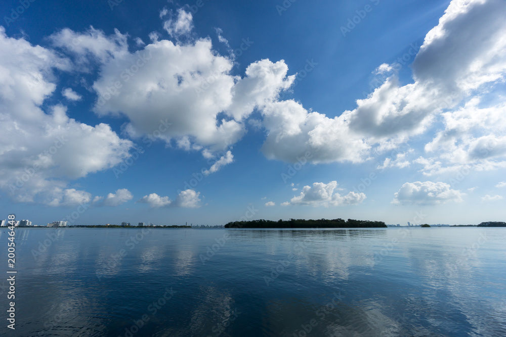 USA, Florida, Waterfront near Miami with mangrove trees and reflecting clouds