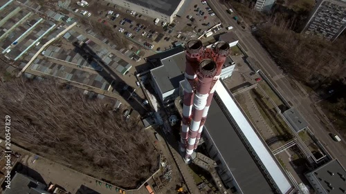 Smoking pipes in industrial zone of the city near residential area