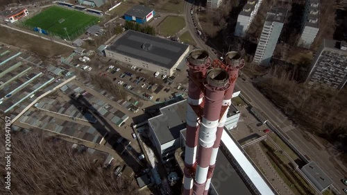 Smoking pipes in industrial zone of the city near residential area