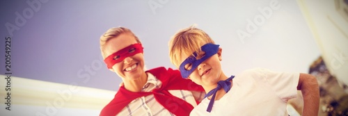 Mother and son playing super heroes