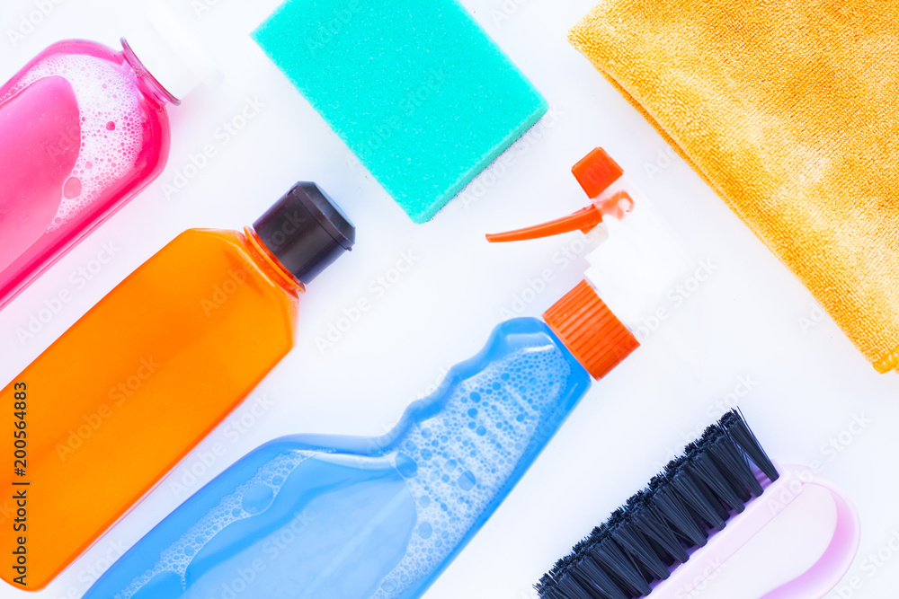 Set of colorful cleaning products isolated on white background. Cleaning service concept. Space for a text.