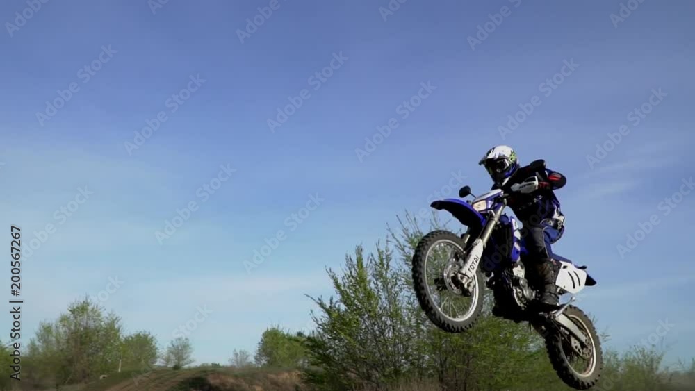 Enduro motocross off-road racing. dust from under the wheels Enduro motocross off-road racing. dust from under the wheels