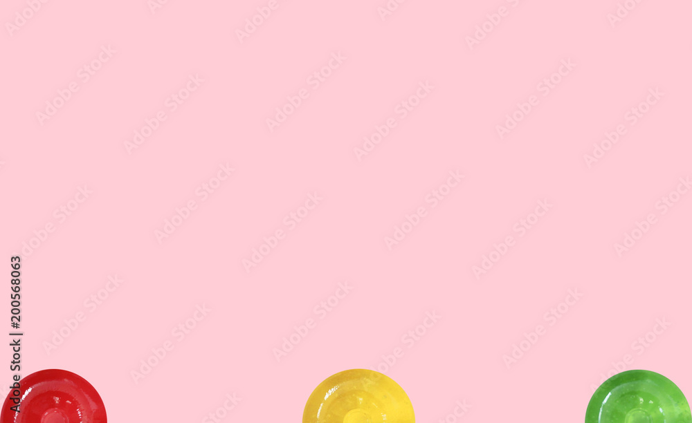stock-photo-pink-background-with-colorful-candy-top-view
