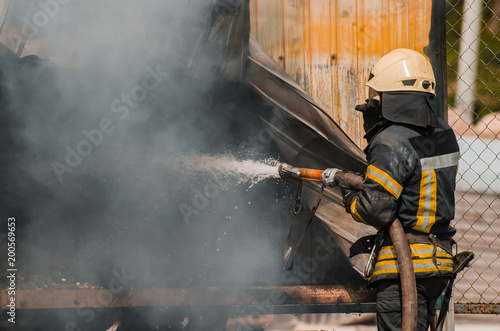 fireman extinguishes fire © Andrii