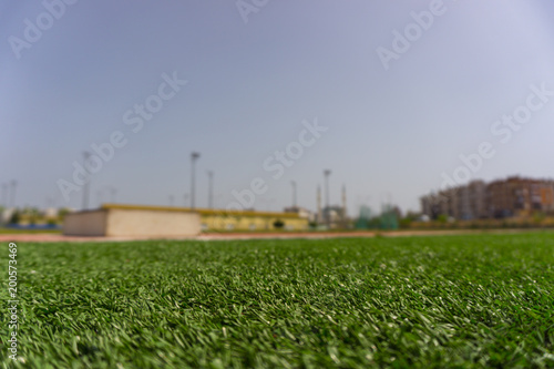 Close low angle view of pitch in urban stadium photo