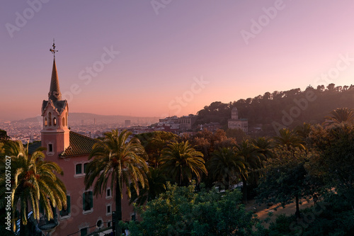 Beautiful high angle view of the Barcelona from Park Guell during pink vanilla sunset