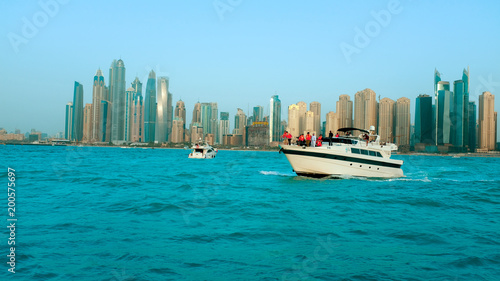 Dubai Marina skyscrapers with yacht and water view