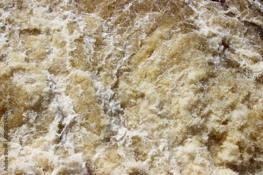 Background, water texture from the foam and surf, waterfall Background, water texture from the foam and surf, waterfall