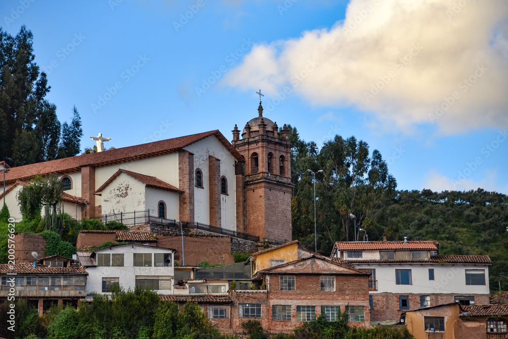 The Church of San Cristobal overlooks the city, in front of Cristo Blanco and the Inca site of Sacsayhuaman