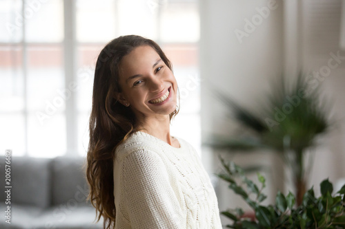 Billede på lærred Cheerful happy mestizo girl with beautiful smile looking at camera, happy friend