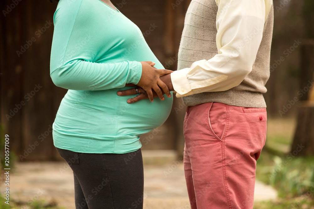 Loving pregnant African American couple. Loving pregnant African American couple.