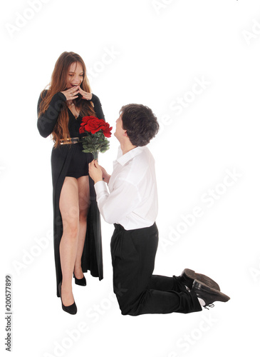 Man proposing to his girlfriend on his knees