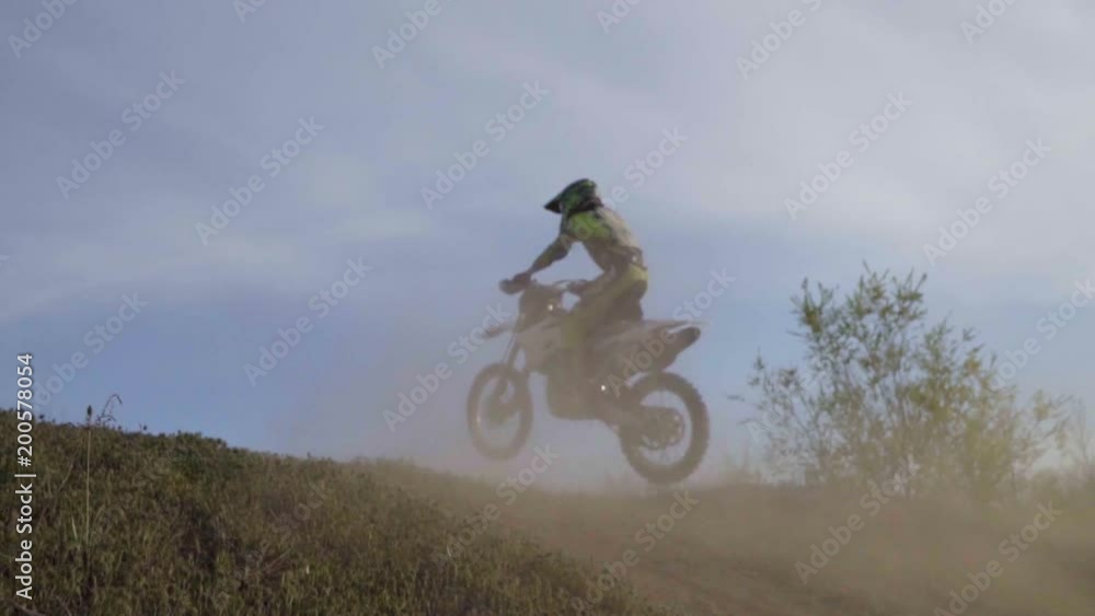 Enduro motocross off-road racing. dust from under the wheels Enduro motocross off-road racing. dust from under the wheels