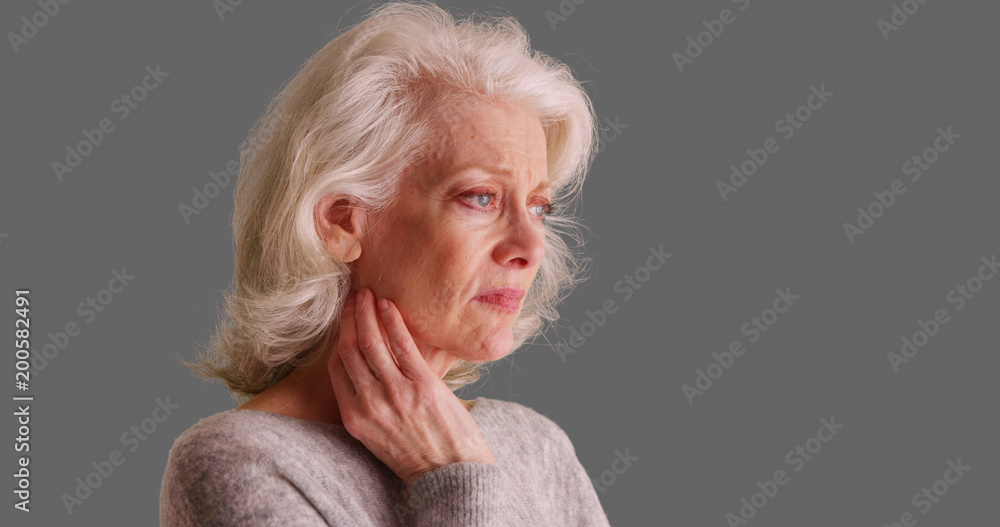 Mournful Caucasian female in her 50s with concerned look on her face on ...