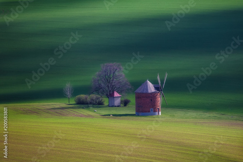 old windmills in Moravia region, Czech Republic in green spring landscape photo