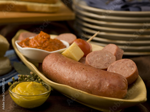 bratwurst and cheese on abundant table photo