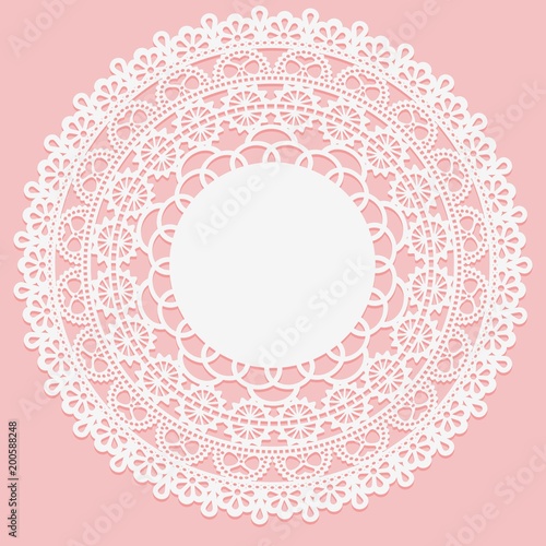 Openwork white napkin. Lace frame round element on pink background.