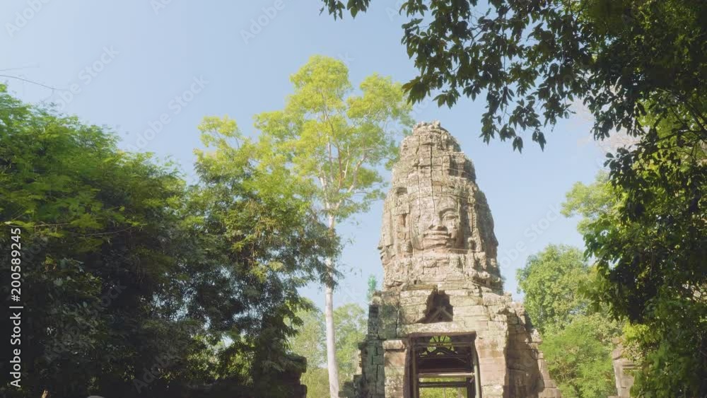 View ofruins of part of Angkor wat temple on sunny day View ofruins of part of Angkor wat temple on sunny day