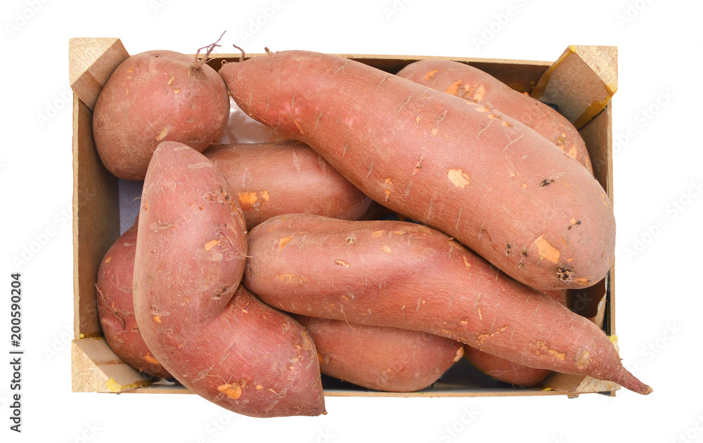 Bunch of sweet potatoes in a wooden crate on a white background Bunch of sweet potatoes in a wooden crate on a white background
