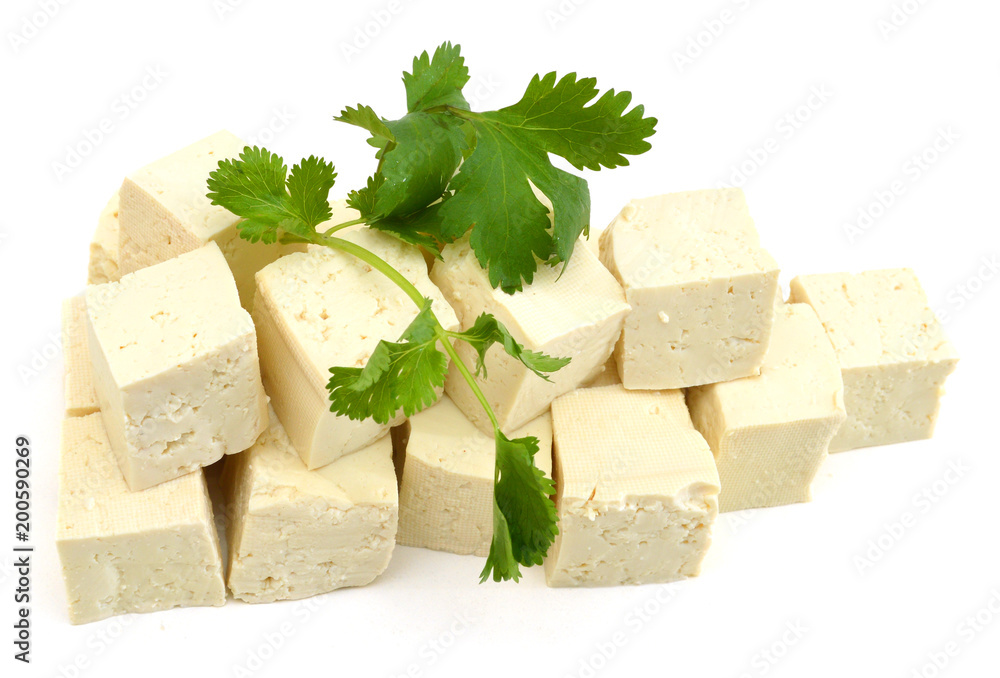 Fresh Tofu cubes and Cilantro isolated on white Fresh Tofu cubes and Cilantro isolated on white