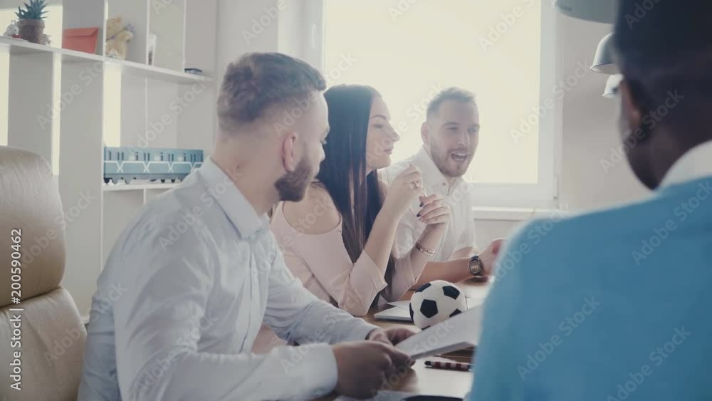 Multiethnic business people discuss contract and partnership at the table. Company board meeting in modern office 4K. Multiethnic business people discuss contract and partnership at the table. Company board meeting in modern office 4K.
