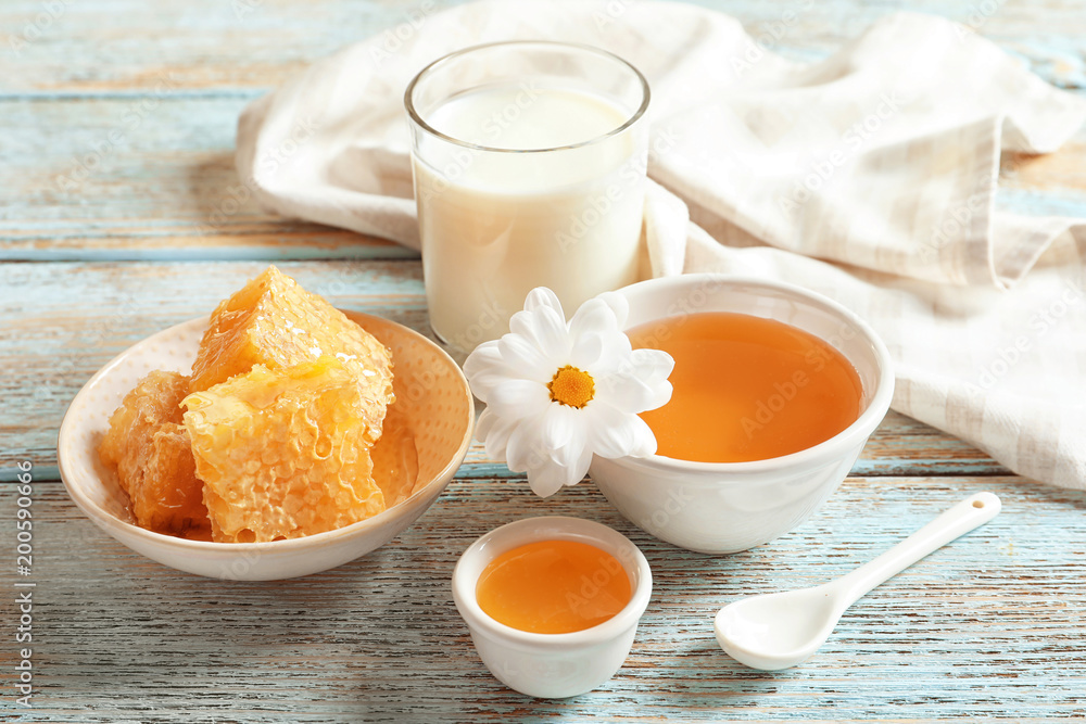 Beautiful composition with milk and honey on wooden background Beautiful composition with milk and honey on wooden background