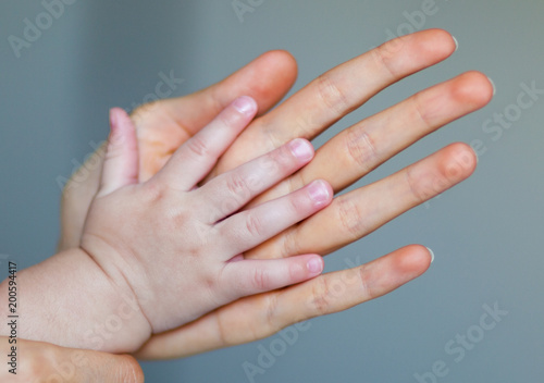 palm of the hand of mother and child.