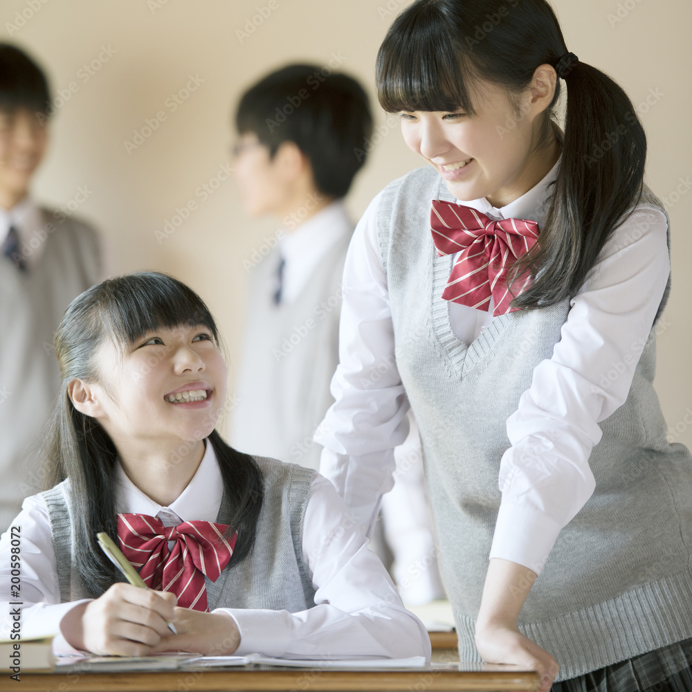 教室で談笑をする中学生 Stock Photo Adobe Stock