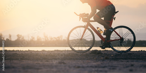 A cyclist riding a road bike on road in the moring