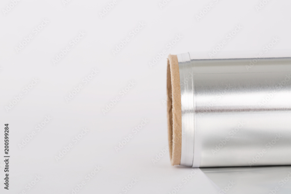Close up of an aluminum foil on white background Close up of an aluminum foil on white background