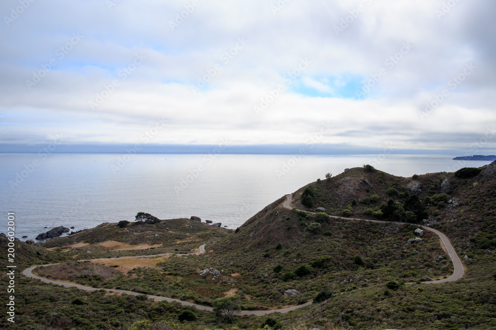 Empty road winds down the California coast on the Marin County seaside Empty road winds down the California coast on the Marin County seaside