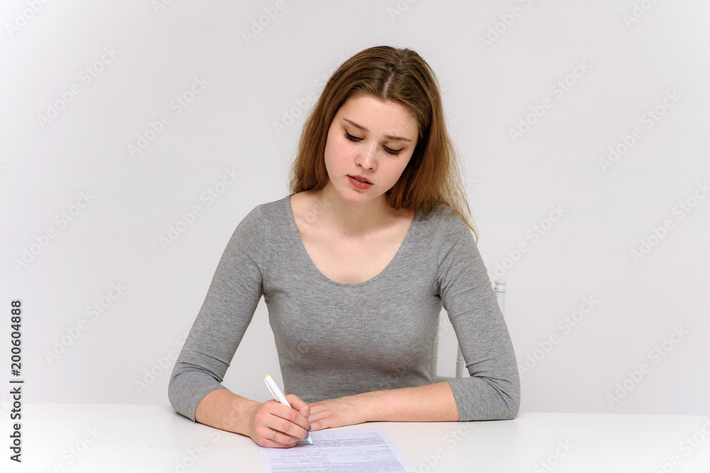 beautiful girl is sitting at the table beautiful girl is sitting at the table