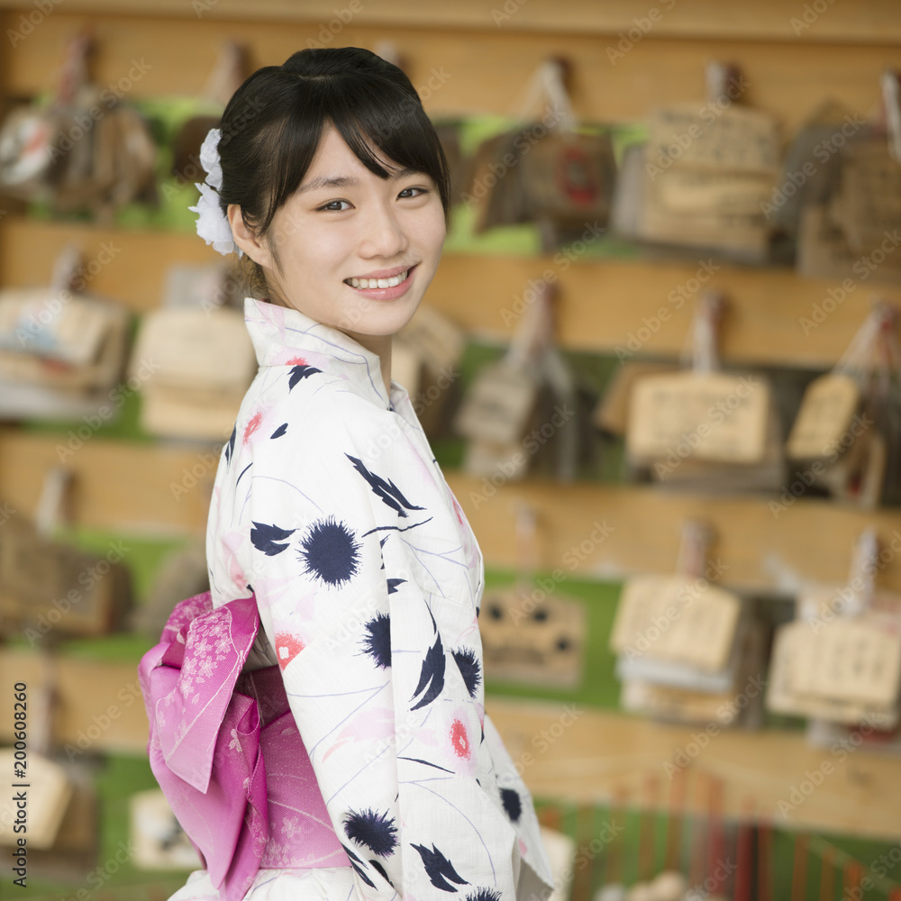 絵馬掛けの前で微笑む浴衣姿の女性 Stock Photo Adobe Stock